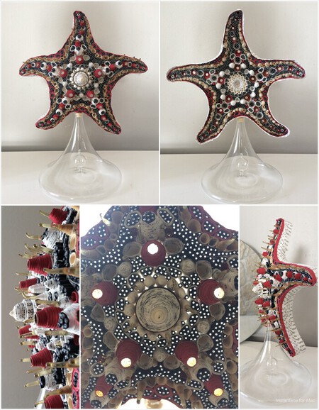 Etoile de mer 2( 29 cm avec support): carafe en verre, fibre optique, pages de livre, embouts d'ampoules en verre, papier dor&eacute; de carton &agrave; p&acirc;tisserie, papier dessin color&eacute;.